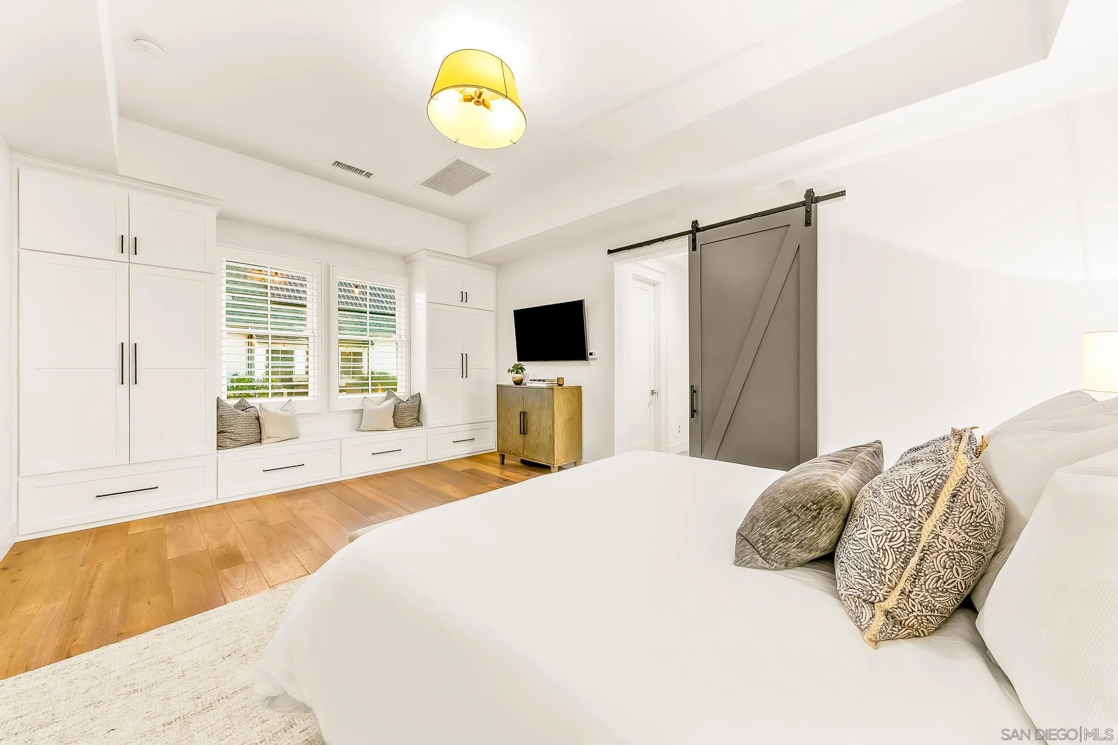 1245 Canton Court Encinitas, CA 92007 - Photo 36 of 71 a bedroom with a bed and a large window