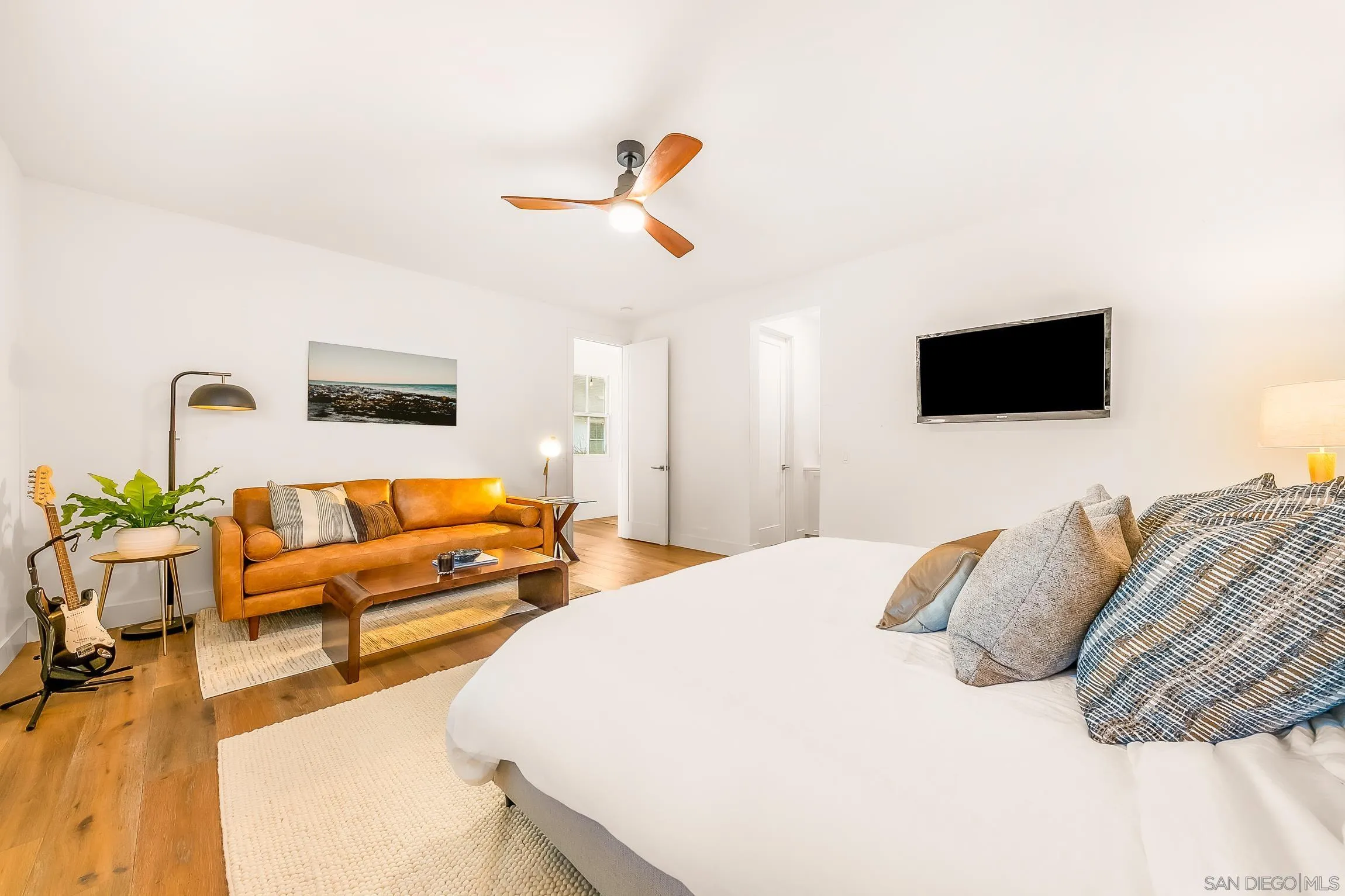 1245 Canton Court Encinitas, CA 92007 - Photo 46 of 71 a bedroom with a bed and a flat screen tv