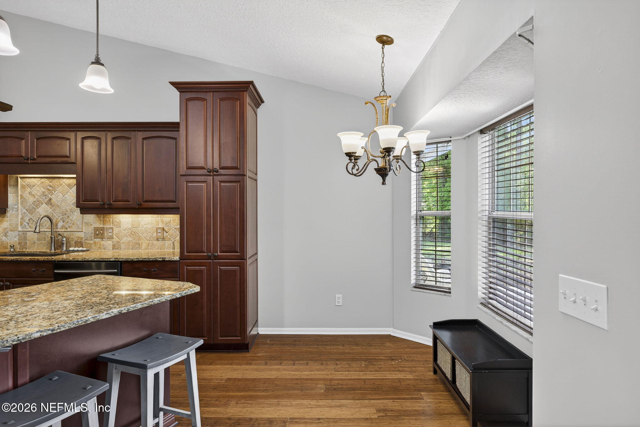 394 Cassandra Lane St. Augustine, FL 32086 - Photo 15 of 43 a kitchen with stainless steel appliances granite countertop a stove and a refrigerator