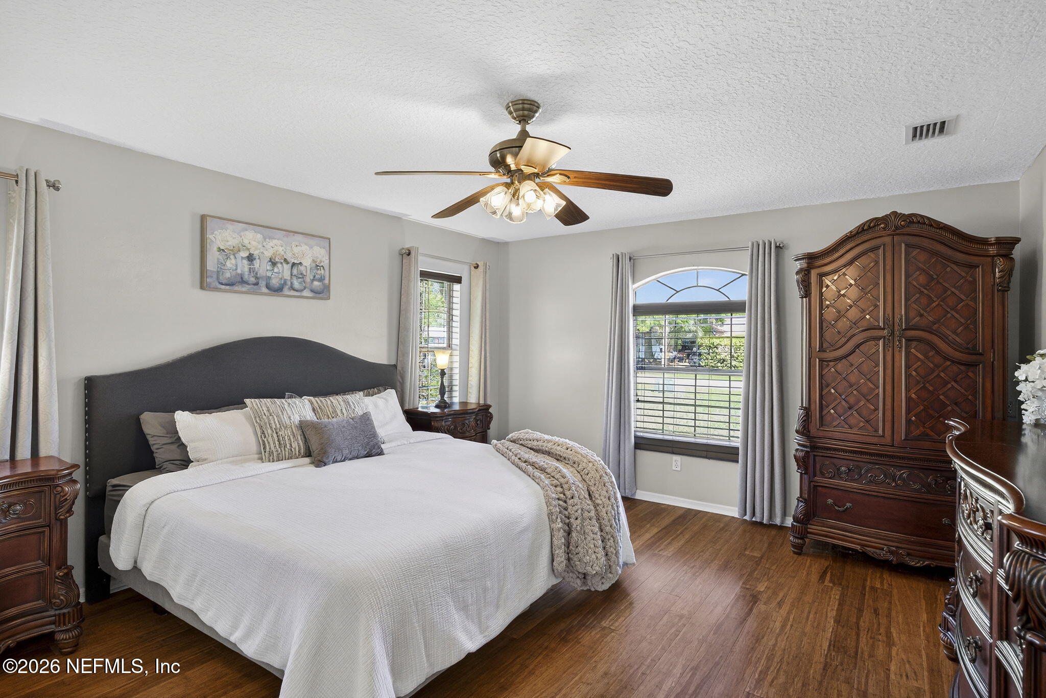 394 Cassandra Lane St. Augustine, FL 32086 - Photo 16 of 43 a bedroom with a bed and wooden floor