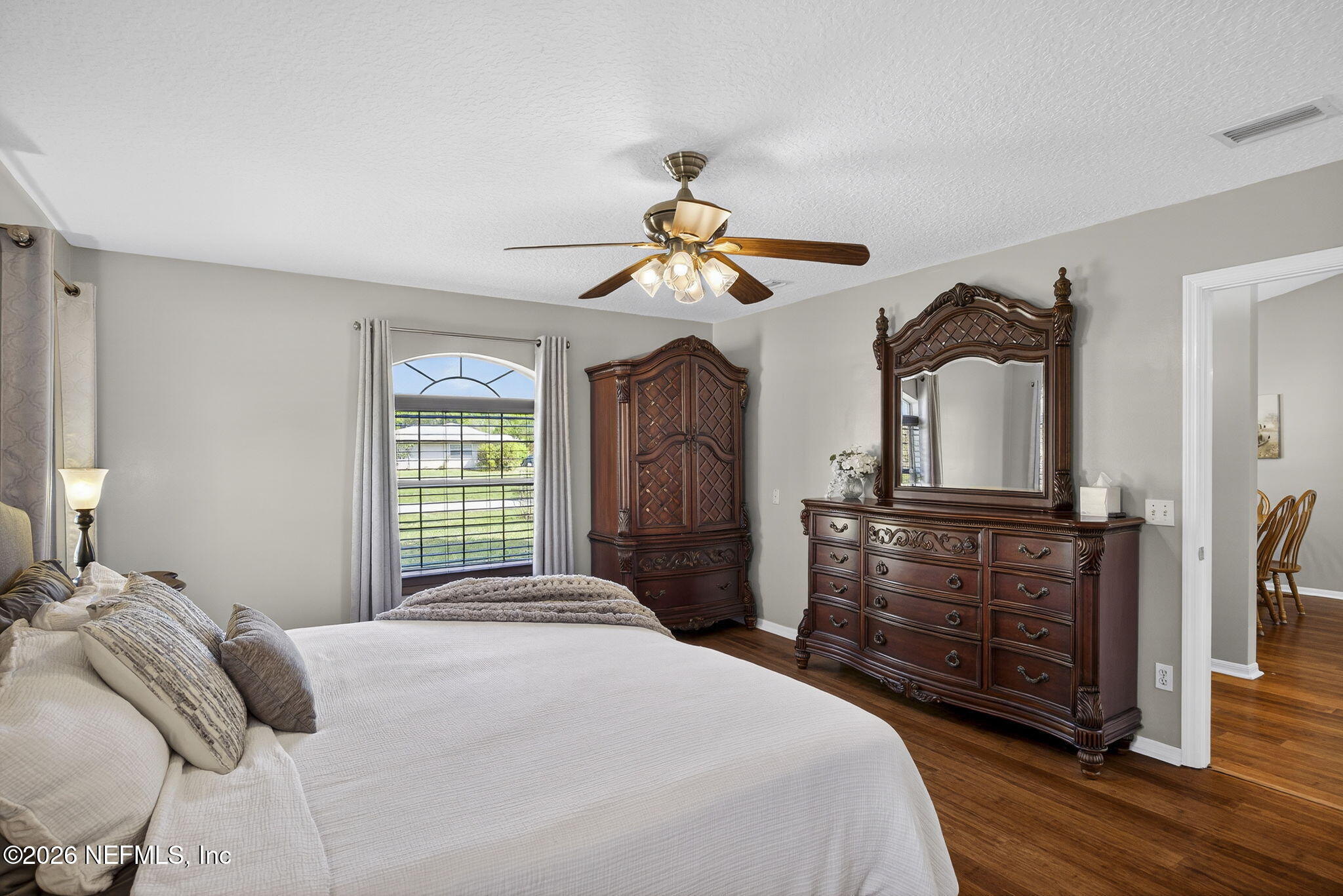 394 Cassandra Lane St. Augustine, FL 32086 - Photo 18 of 43 a bedroom with a bed and a chandelier