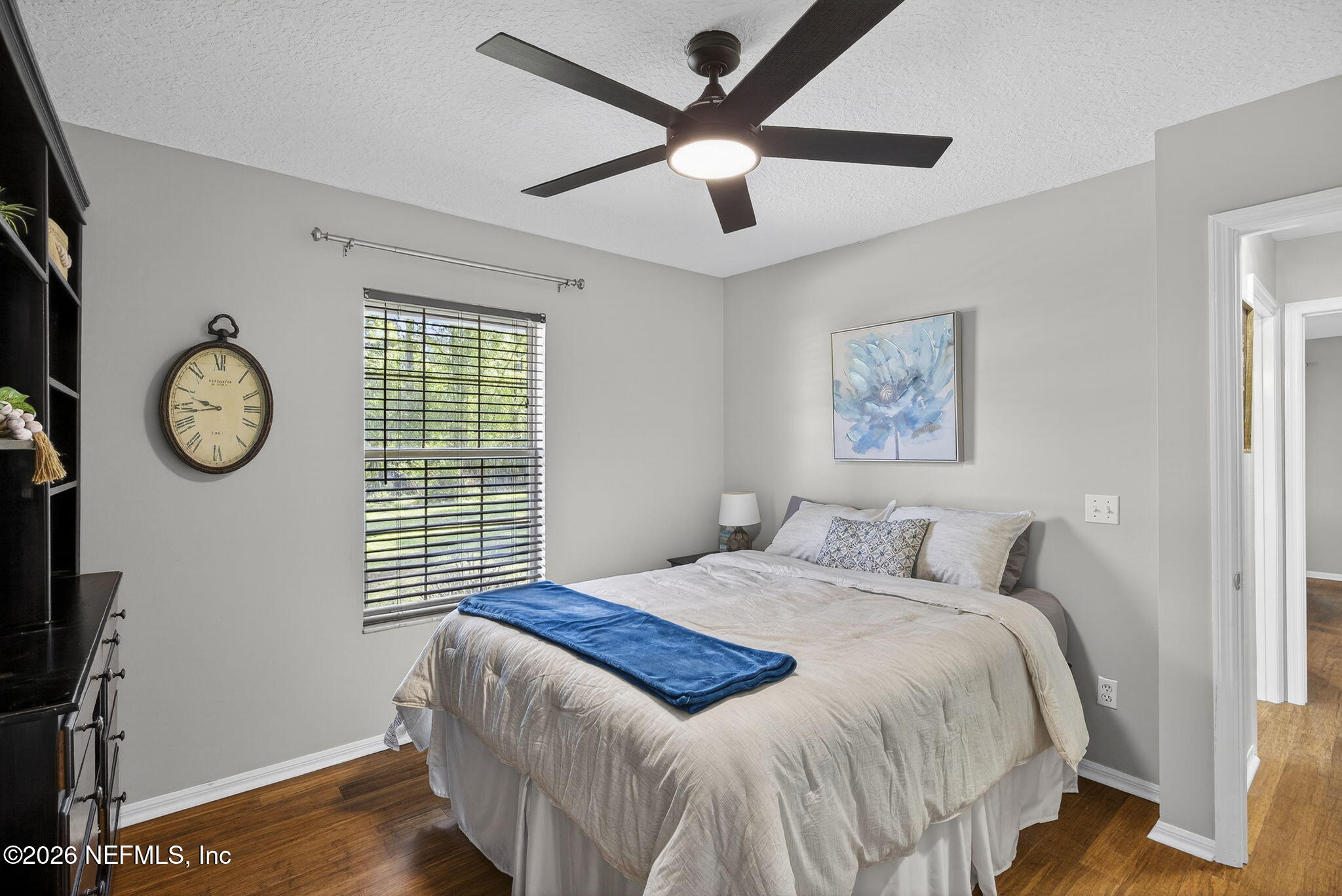 394 Cassandra Lane St. Augustine, FL 32086 - Photo 24 of 43 a bedroom with a bed and a chandelier