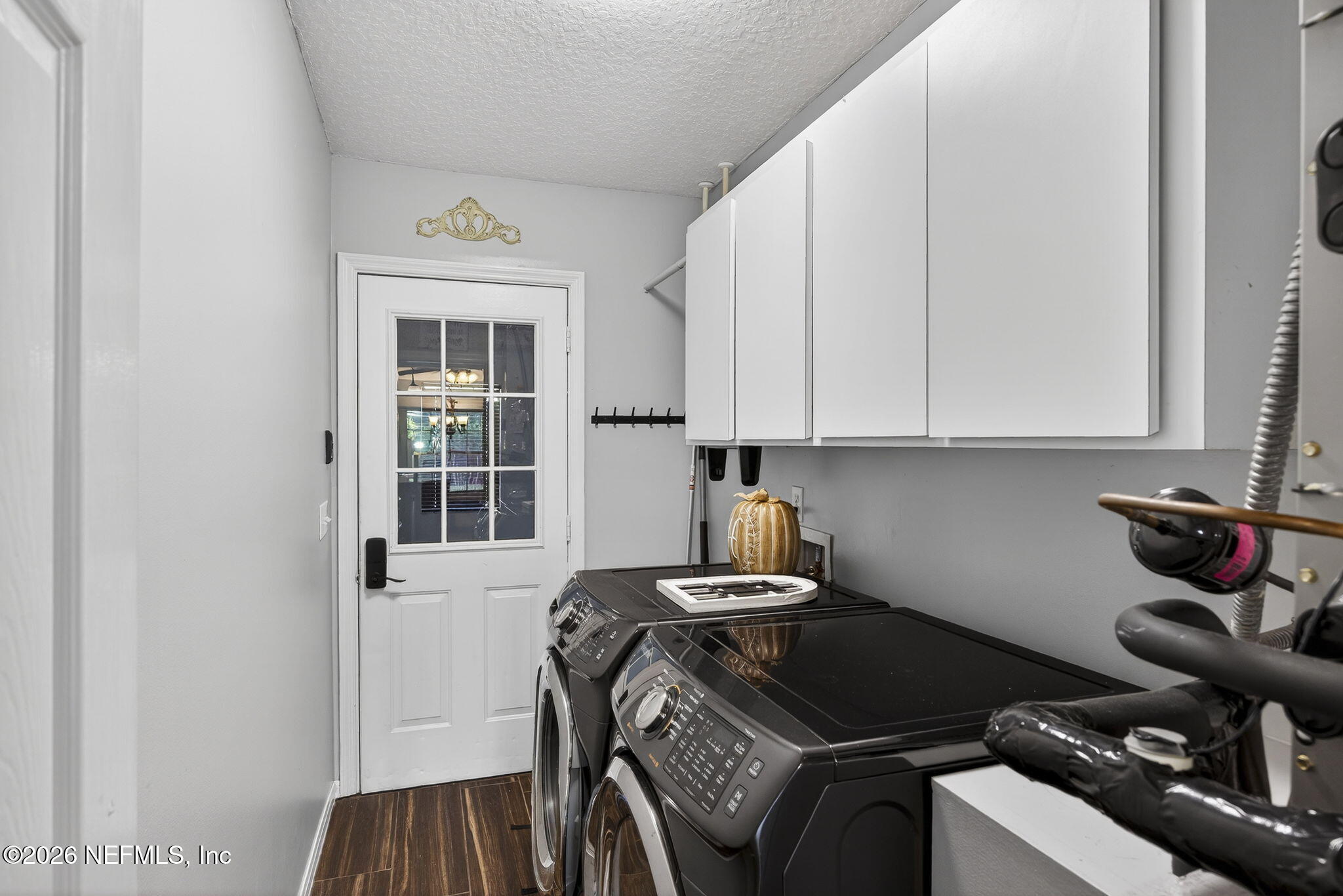 394 Cassandra Lane St. Augustine, FL 32086 - Photo 27 of 43 a kitchen with a stove and a refrigerator