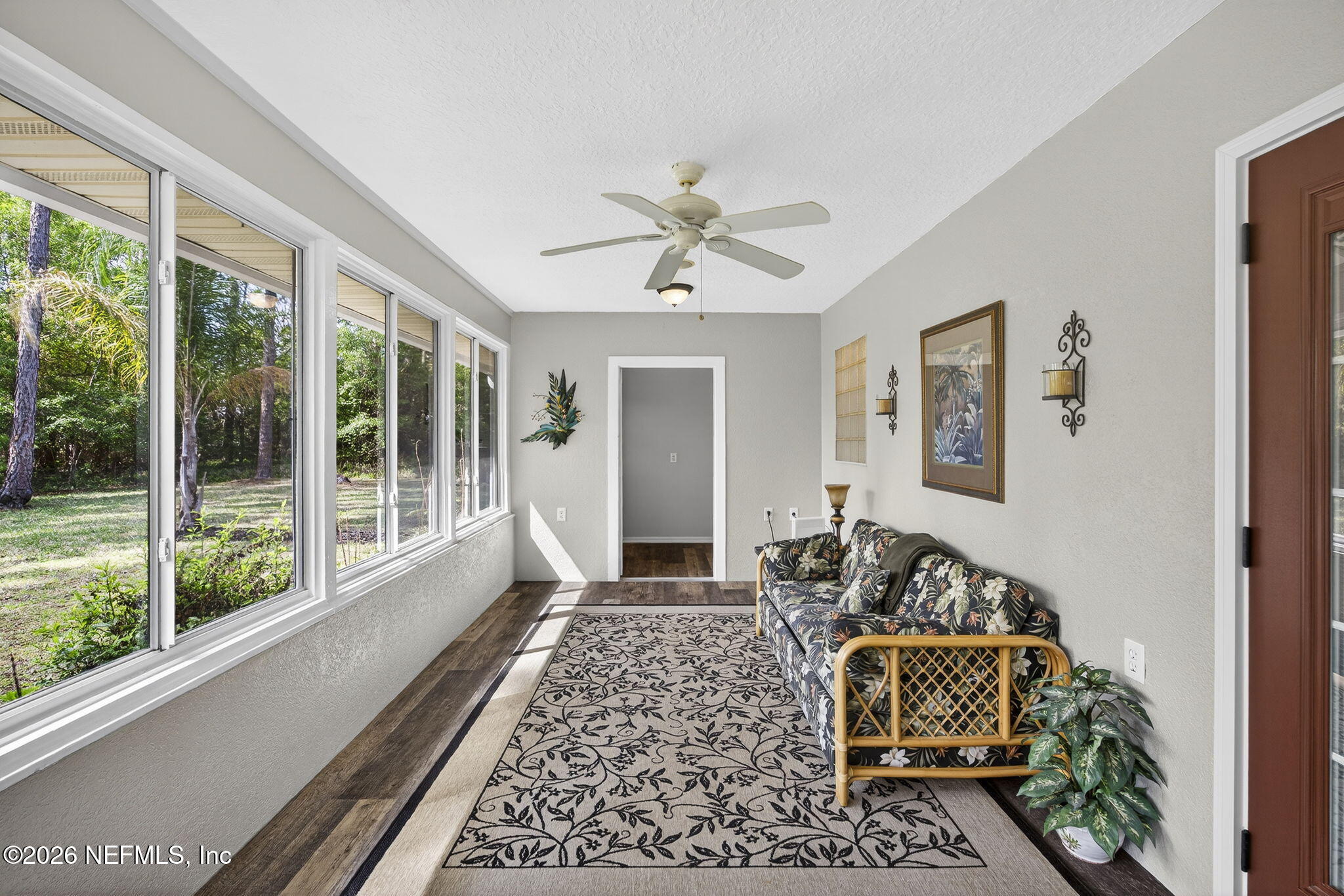 394 Cassandra Lane St. Augustine, FL 32086 - Photo 28 of 43 a living room with furniture and a large window