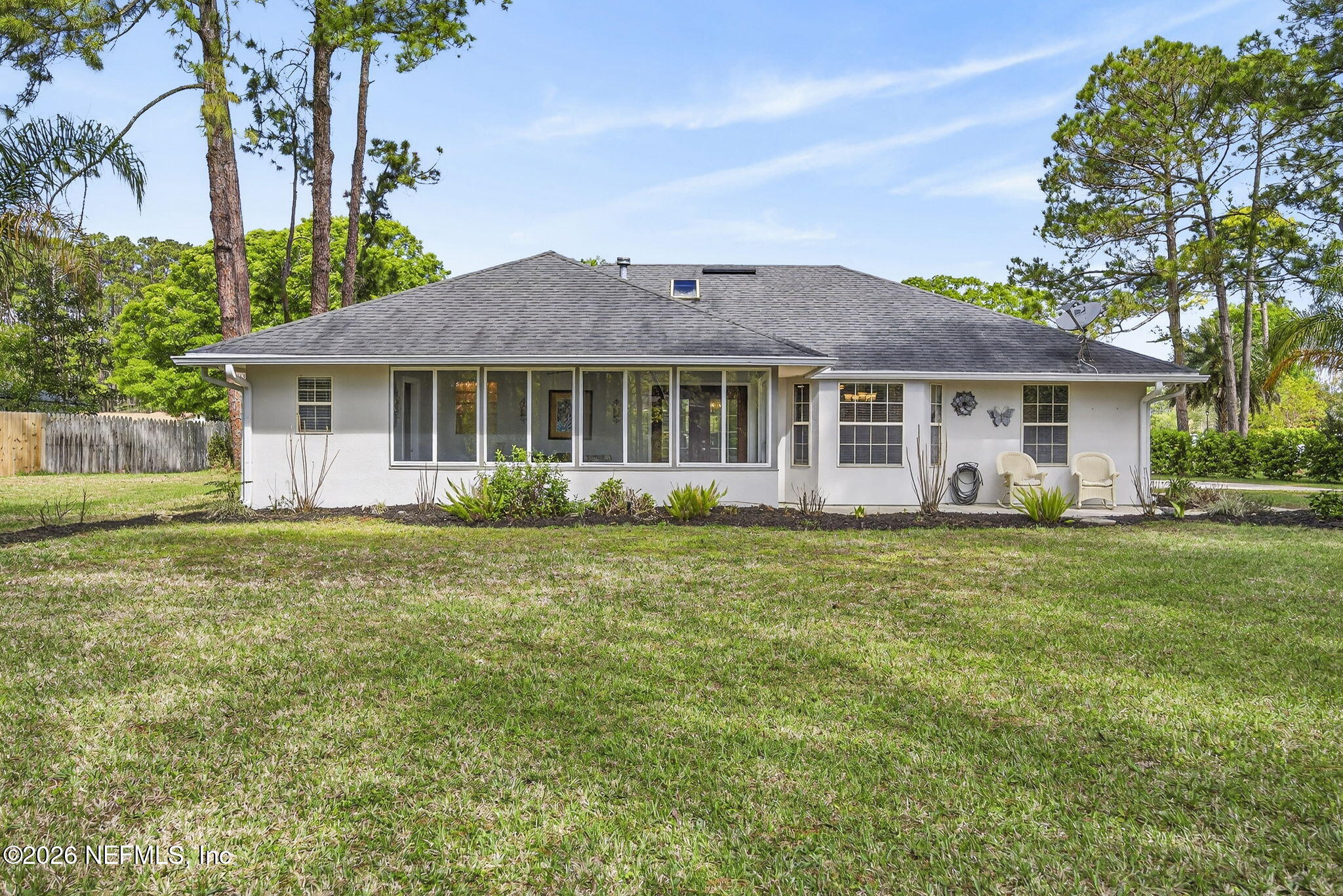 394 Cassandra Lane St. Augustine, FL 32086 - Photo 30 of 43 a front view of a house with a garden