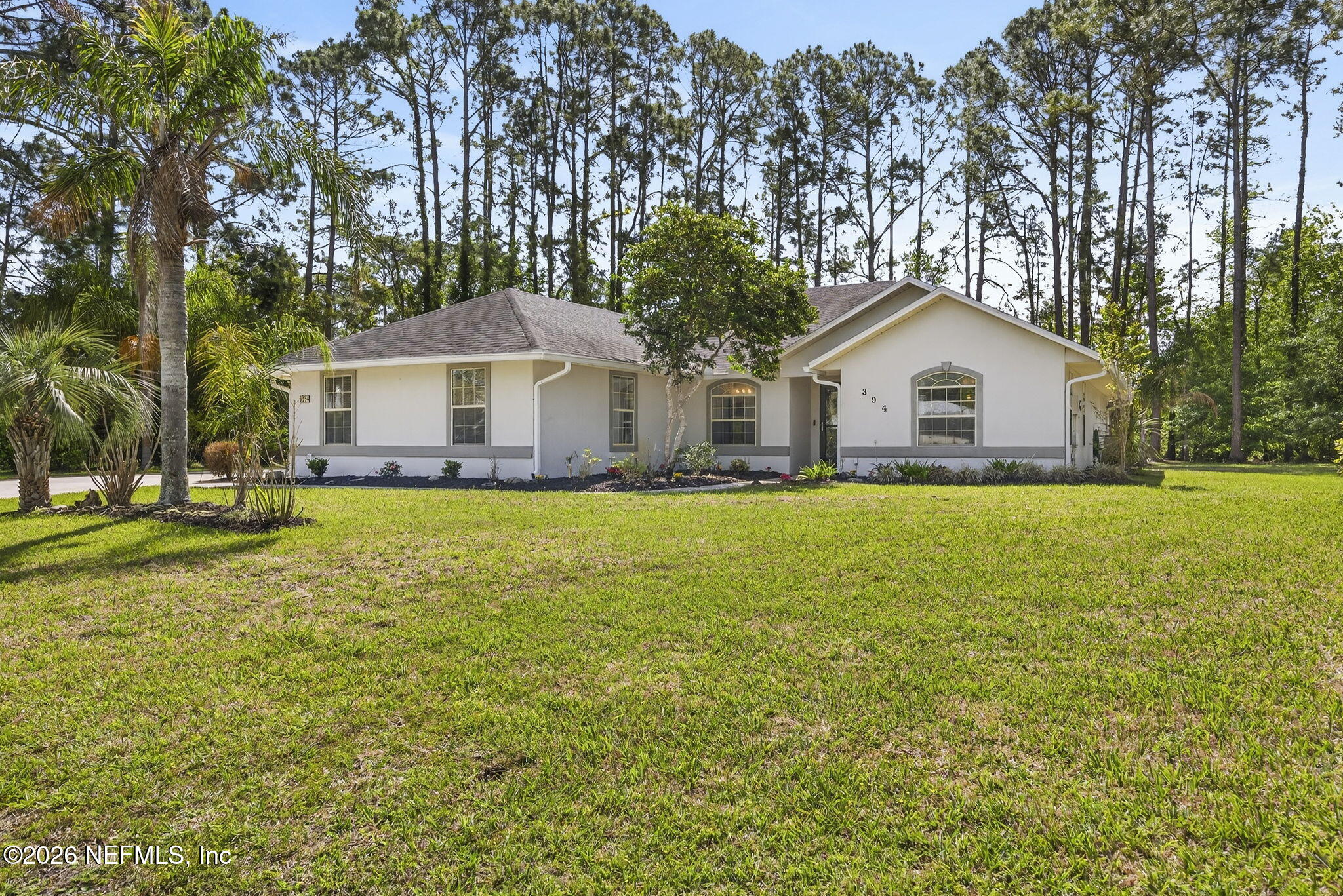 394 Cassandra Lane St. Augustine, FL 32086 - Photo 3 of 43 a front view of a house with yard and green space