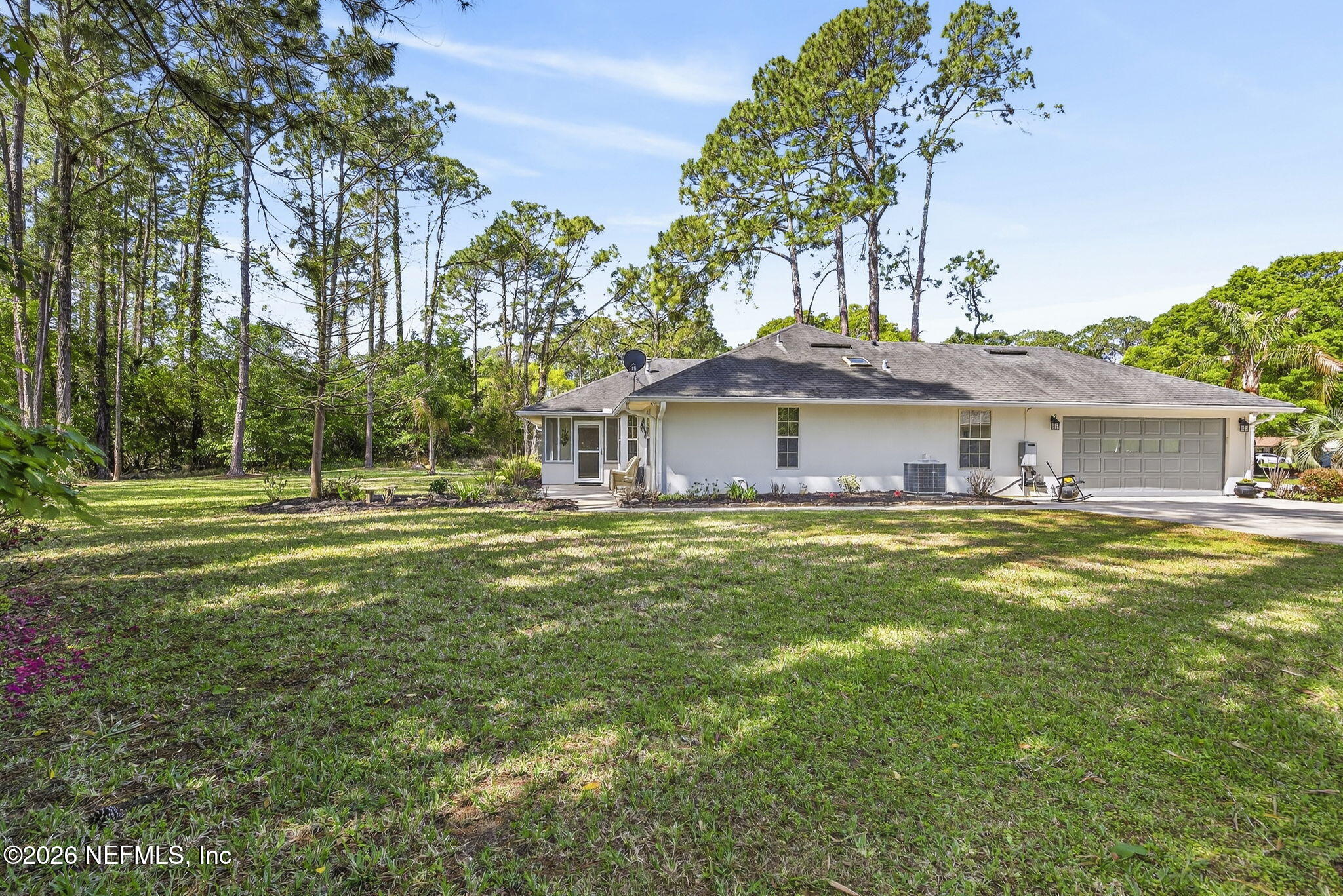 394 Cassandra Lane St. Augustine, FL 32086 - Photo 32 of 43 a front view of a house with a garden