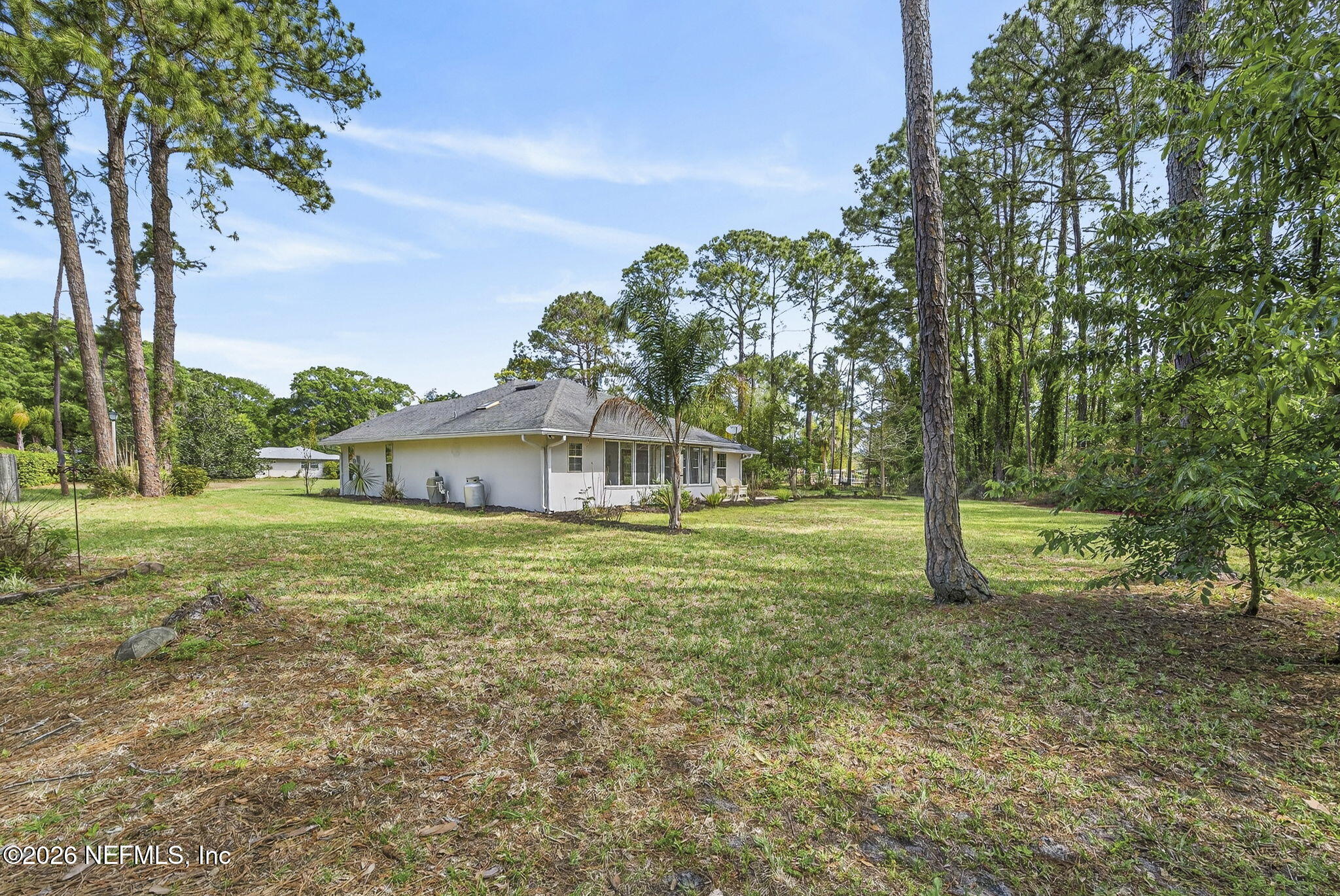 394 Cassandra Lane St. Augustine, FL 32086 - Photo 33 of 43 a view of a house with a yard and a tree