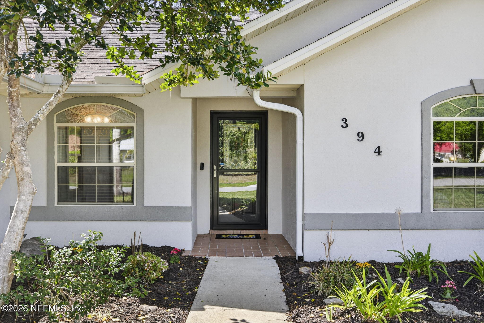 394 Cassandra Lane St. Augustine, FL 32086 - Photo 4 of 43 a front view of a house with a yard