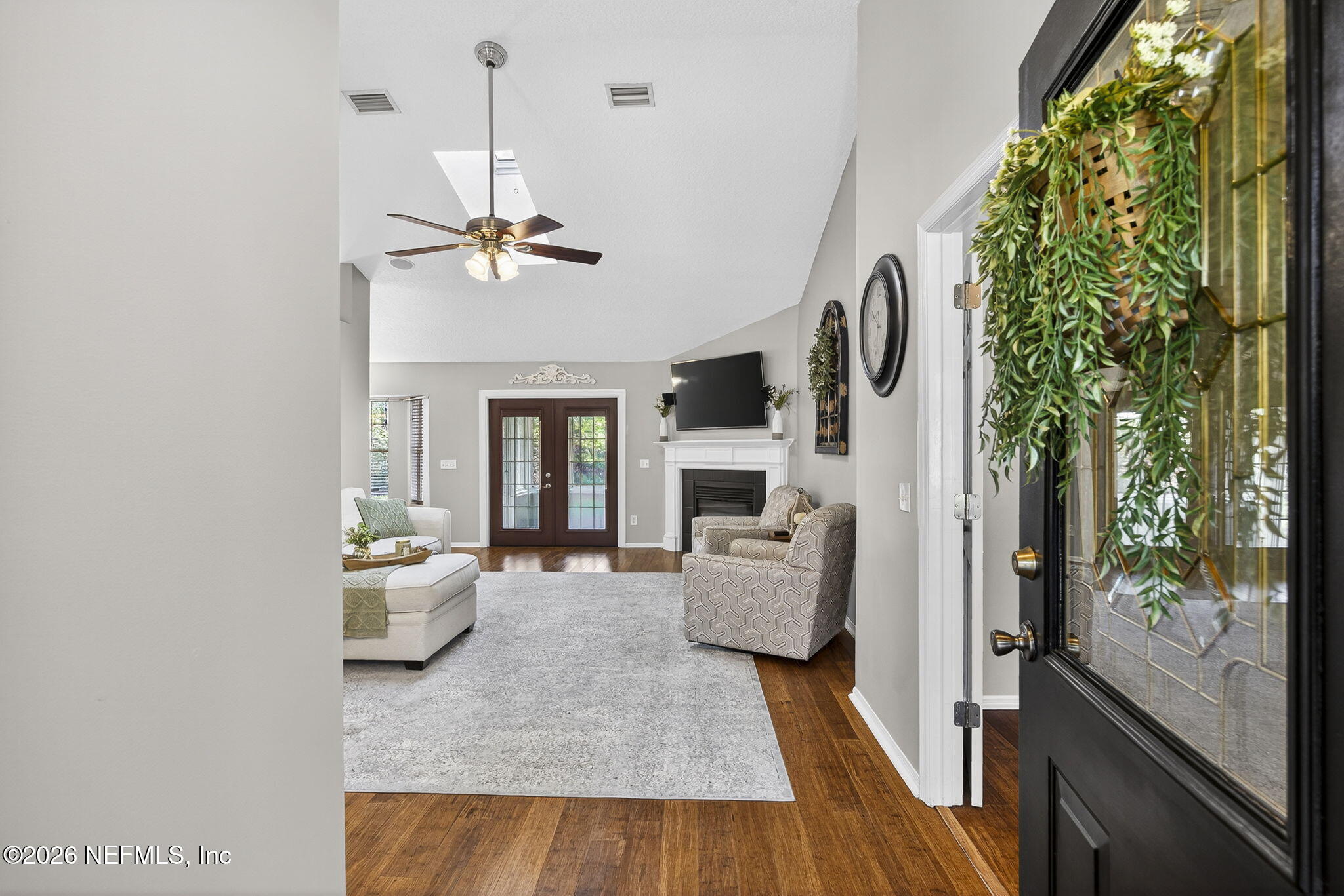 394 Cassandra Lane St. Augustine, FL 32086 - Photo 5 of 43 a living room with patio fireplace furniture and a floor to ceiling window