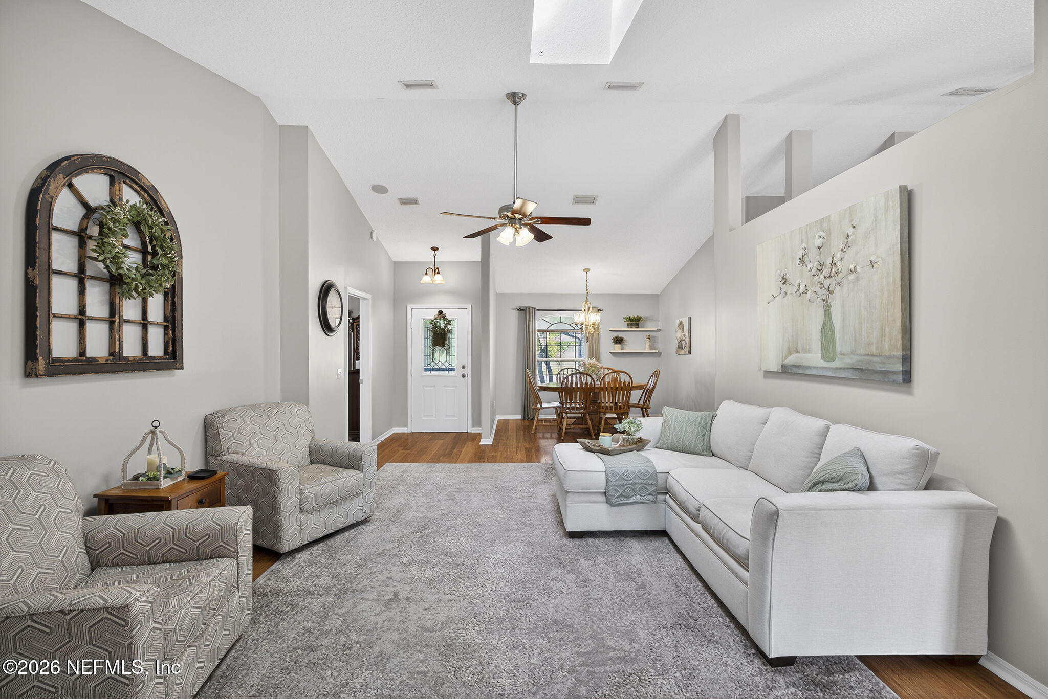 394 Cassandra Lane St. Augustine, FL 32086 - Photo 10 of 43 a living room with furniture and a chandelier