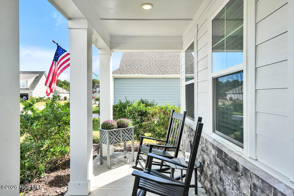142 Rice Marsh Way Wilmington, NC 28412 - Photo 4 of 64 The charming front porch features durable fiber cement and stone siding, and recessed lighting.
