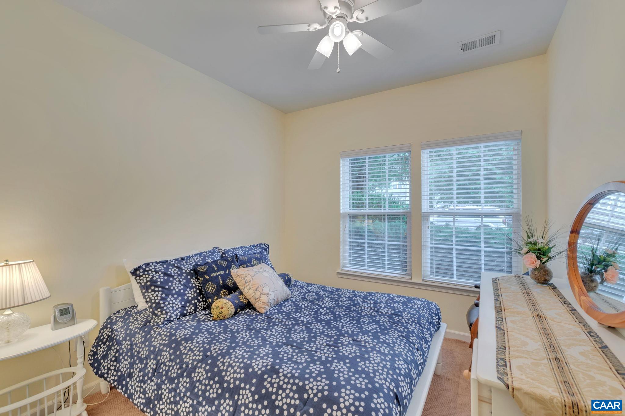 701 Rainier Road Charlottesville, VA 22903 - Photo 6 of 42 a bed sitting in a bedroom next to a window