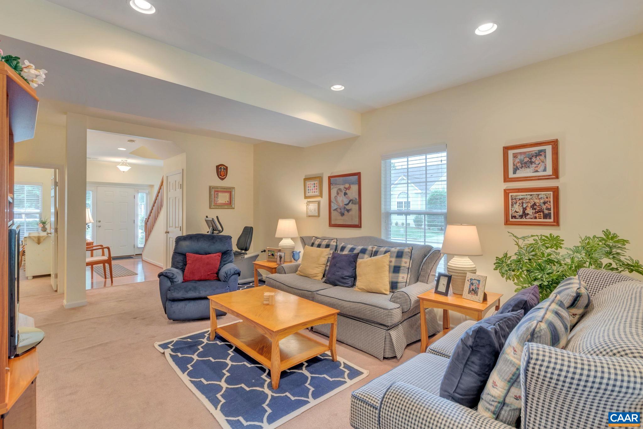 701 Rainier Road Charlottesville, VA 22903 - Photo 8 of 42 a living room with furniture a rug and a window