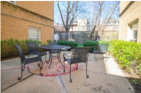 4240 North Clarendon Avenue, Unit 208S Chicago, IL 60613 - Photo 11 of 14 a view of a patio with table and chairs and potted plants
