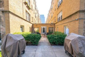 4240 North Clarendon Avenue, Unit 208S Chicago, IL 60613 - Photo 12 of 14 a view of a brick house with large windows
