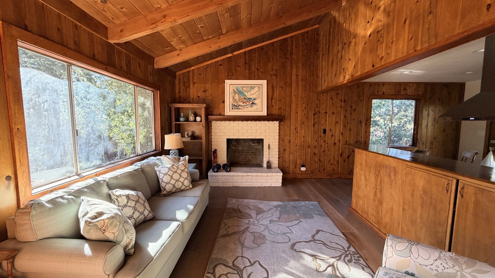 53390 Circle View Drive Idyllwild, CA 92549 - Photo 9 of 22 a living room with furniture a large window and a fireplace