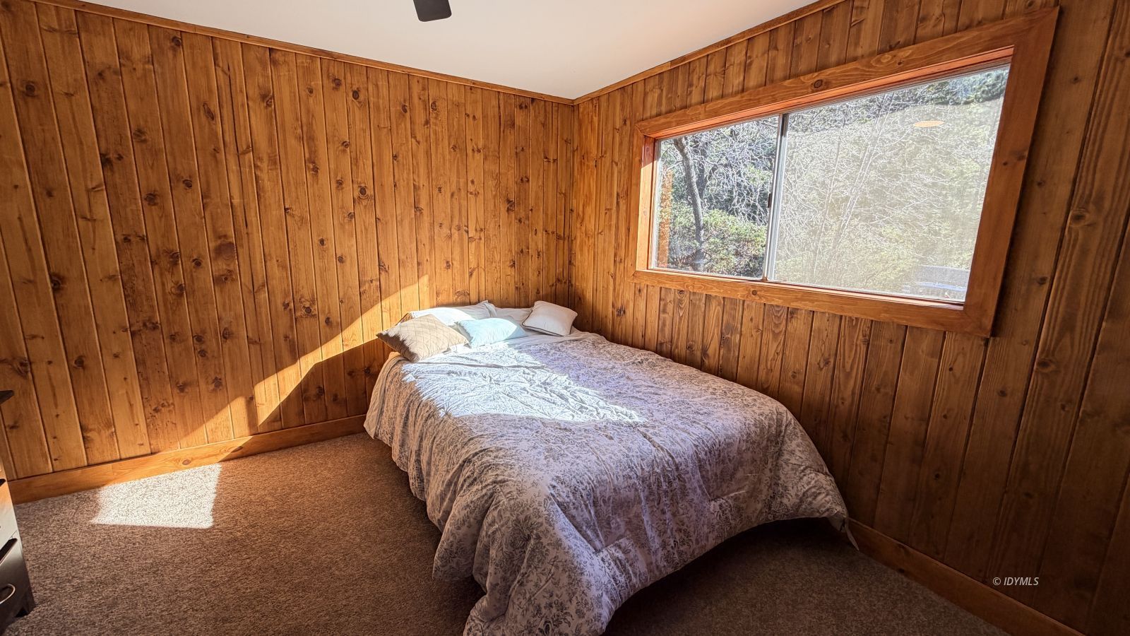53390 Circle View Drive Idyllwild, CA 92549 - Photo 10 of 22 a bed sitting in a bedroom next to a window