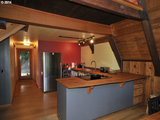 38215 Harolds Road Dexter, OR 97431 - Photo 4 of 16 a kitchen with stainless steel appliances granite countertop a sink and a stove
