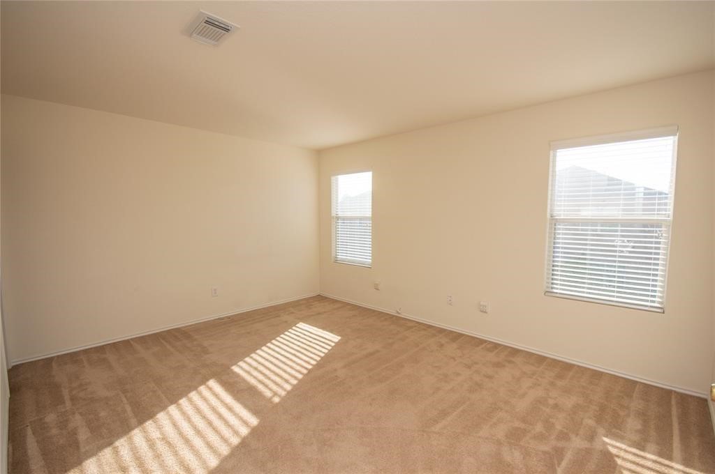 310 Falling Pine Drive Conroe, TX 77304 - Photo 13 of 15 a view of an empty room and window