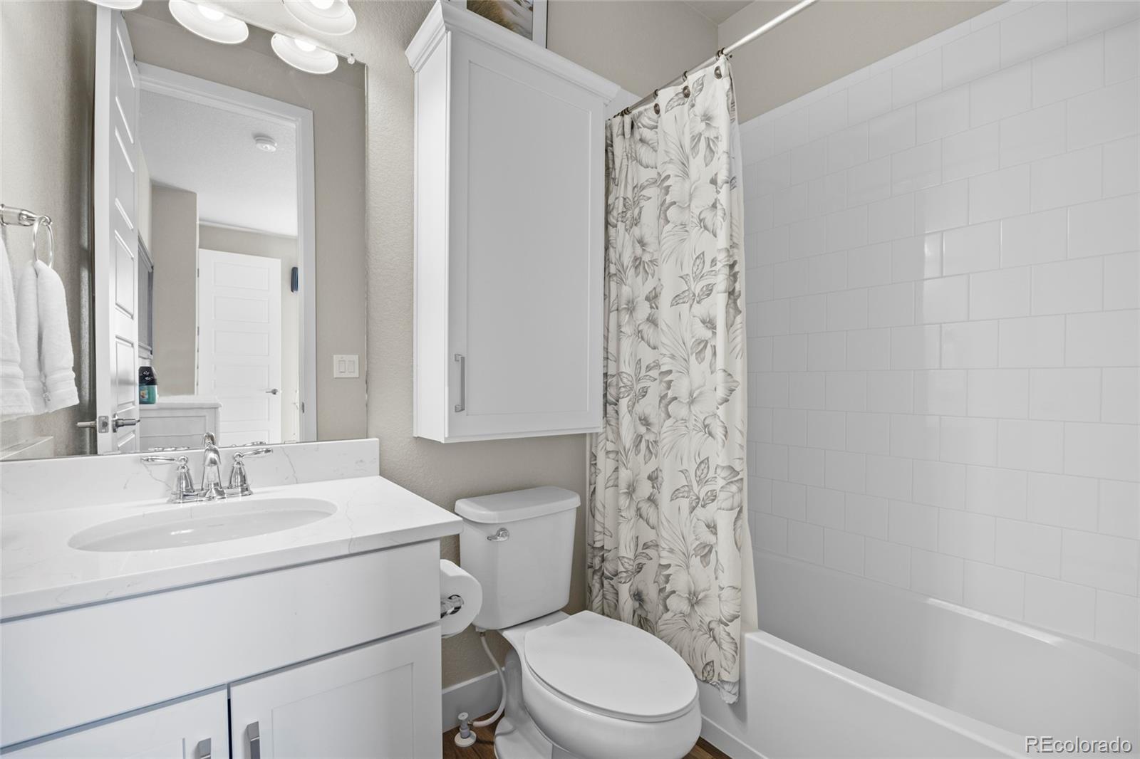 164 Rockingham Circle Castle Pines, CO 80108 - Photo 15 of 43 a bathroom with a sink toilet and shower