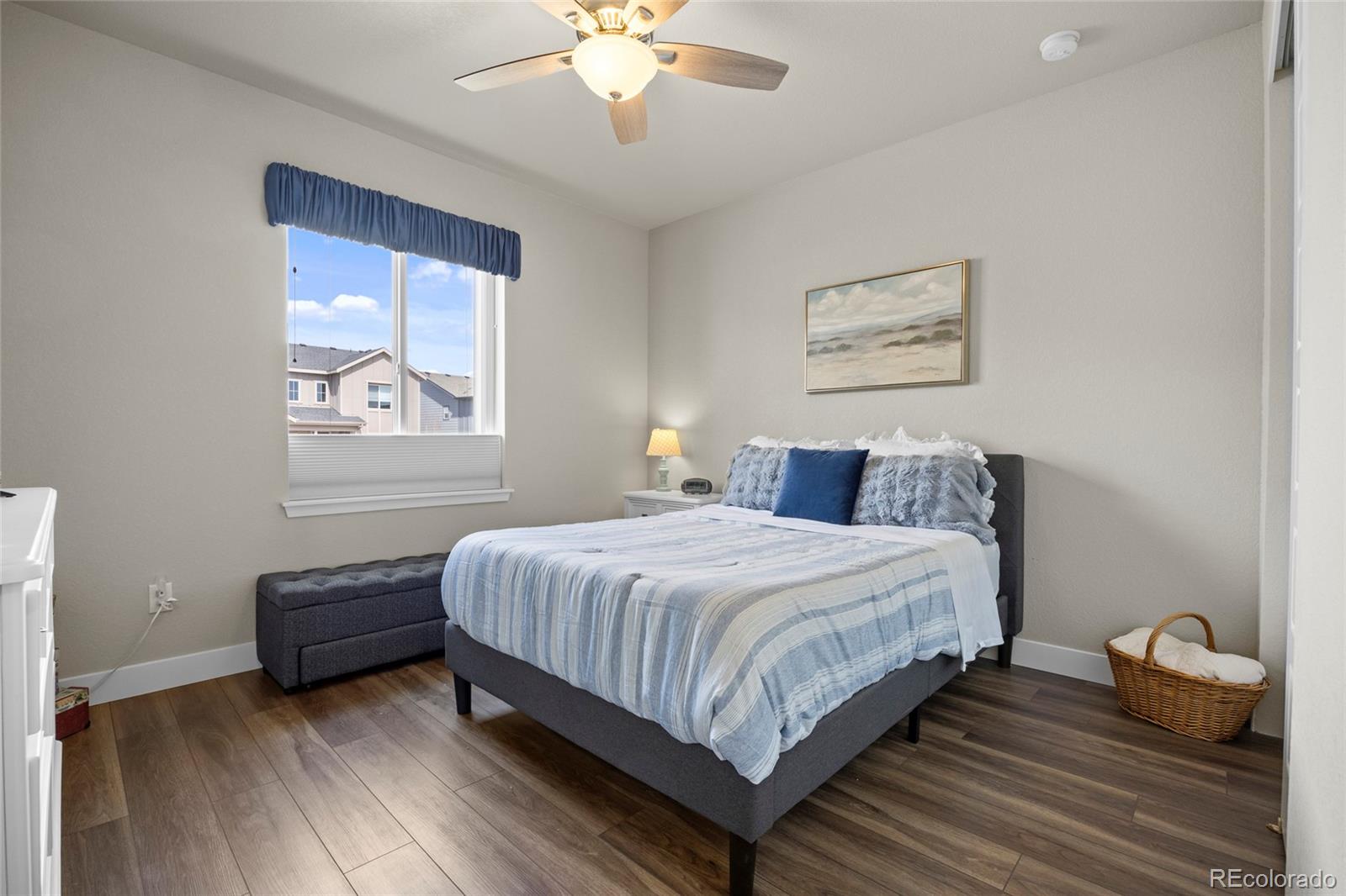 164 Rockingham Circle Castle Pines, CO 80108 - Photo 16 of 43 a bedroom with a bed and a window