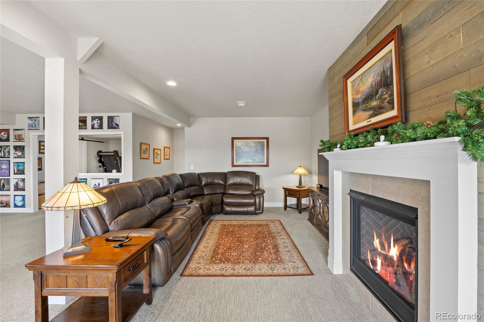 164 Rockingham Circle Castle Pines, CO 80108 - Photo 23 of 43 a living room with furniture and a fireplace