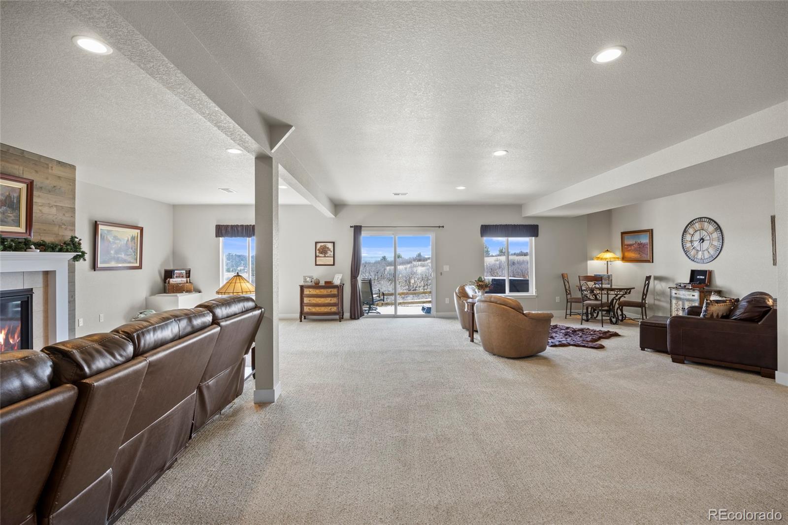 164 Rockingham Circle Castle Pines, CO 80108 - Photo 24 of 43 a living room with furniture and a window