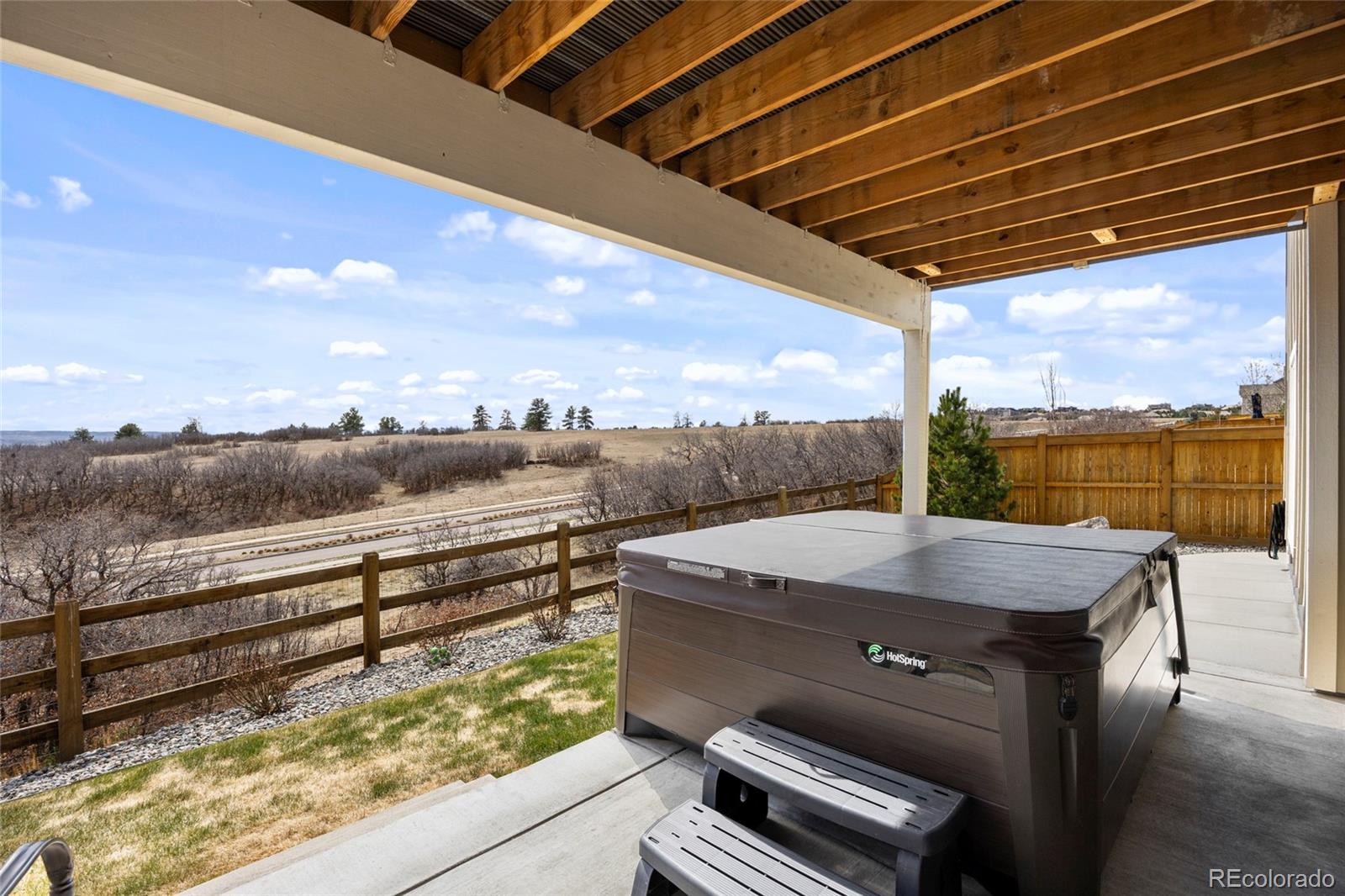 164 Rockingham Circle Castle Pines, CO 80108 - Photo 32 of 43 a view of a terrace with sky view