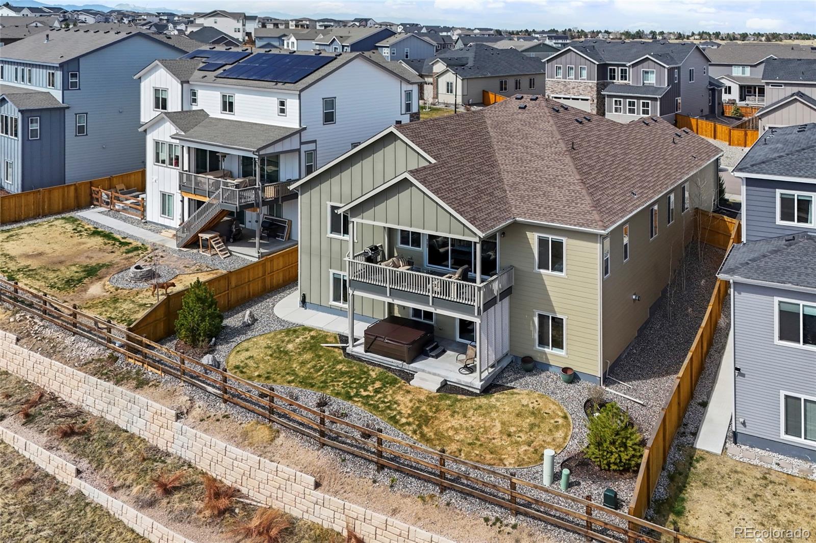 164 Rockingham Circle Castle Pines, CO 80108 - Photo 35 of 43 front view of a house with a small yard