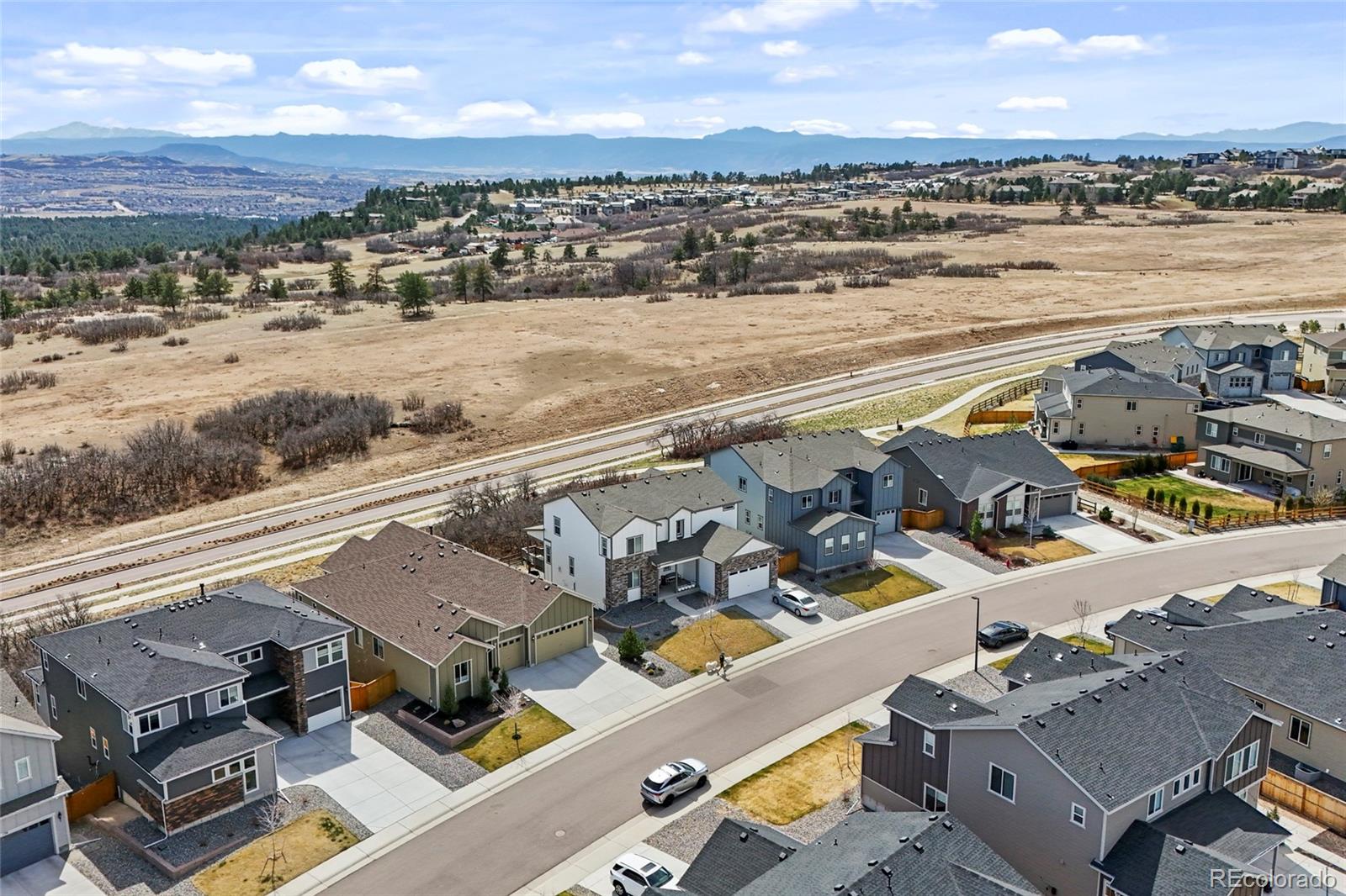 164 Rockingham Circle Castle Pines, CO 80108 - Photo 37 of 43 an aerial view of residential houses with outdoor space