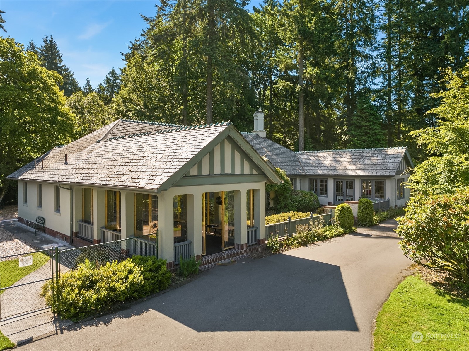 62 Madrona Lane Shoreline, WA 98177 - Photo 8 of 22 a front view of a house with a yard garage and outdoor seating