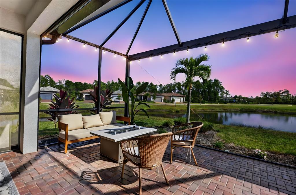 1319 Raspberry Dr Port North Port, FL 34289 - Photo 18 of 70 a patio with water view fountain with swimming pool and outdoor seating
