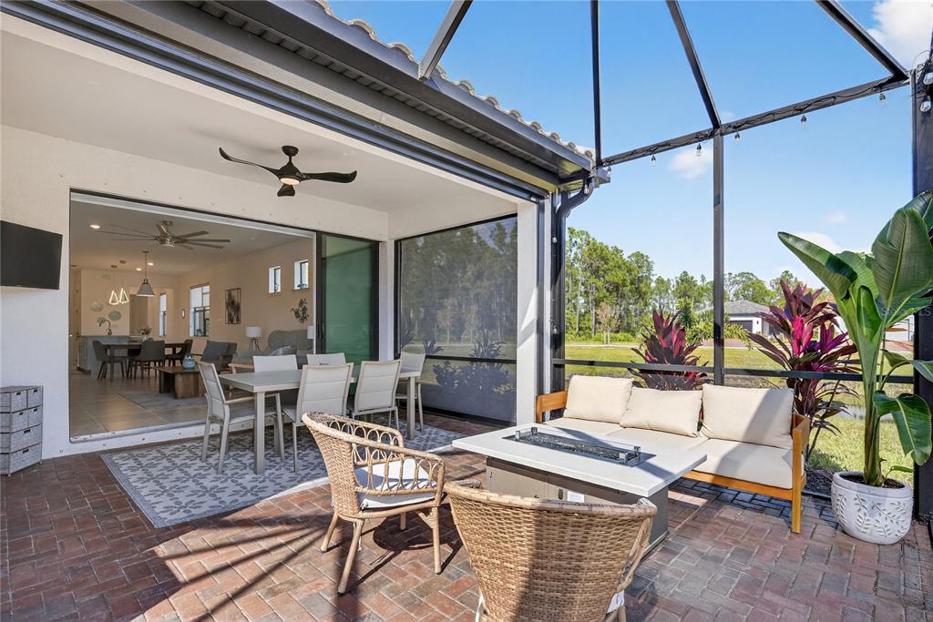 1319 Raspberry Dr Port North Port, FL 34289 - Photo 19 of 70 a living room with patio furniture and a potted plant