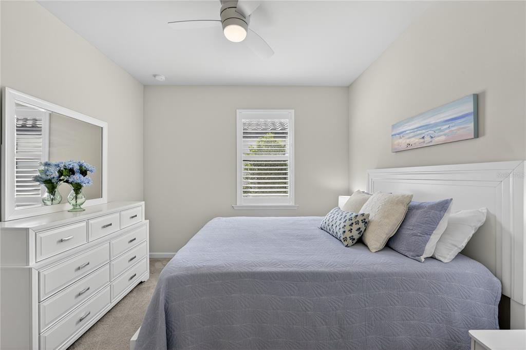 1319 Raspberry Dr Port North Port, FL 34289 - Photo 21 of 70 a bedroom with a bed and a dresser