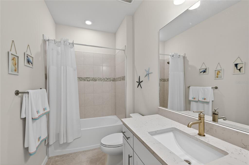1319 Raspberry Dr Port North Port, FL 34289 - Photo 22 of 70 a bathroom with a sink toilet tub and shower