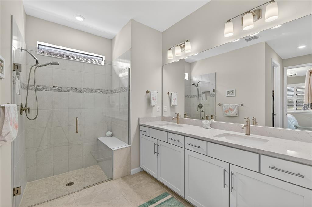 1319 Raspberry Dr Port North Port, FL 34289 - Photo 25 of 70 a bathroom with a double vanity sink toilet and shower