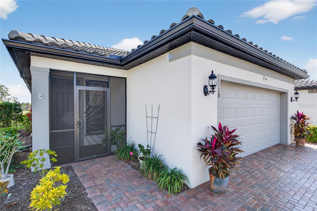 1319 Raspberry Dr Port North Port, FL 34289 - Photo 4 of 70 a view of a entryway door of the house