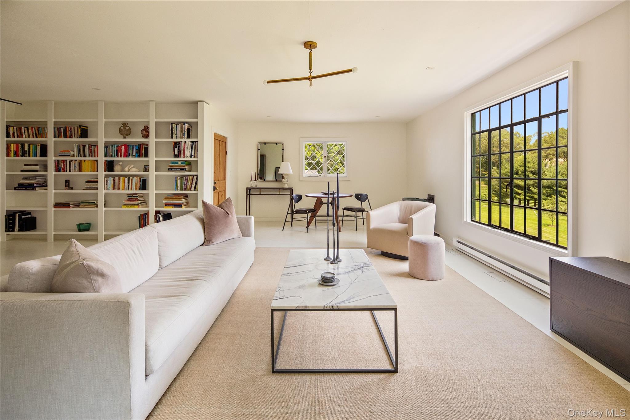310 Mt Holly Road, Unit A Katonah, NY 10536 - Photo 12 of 33 a living room with furniture and a large window