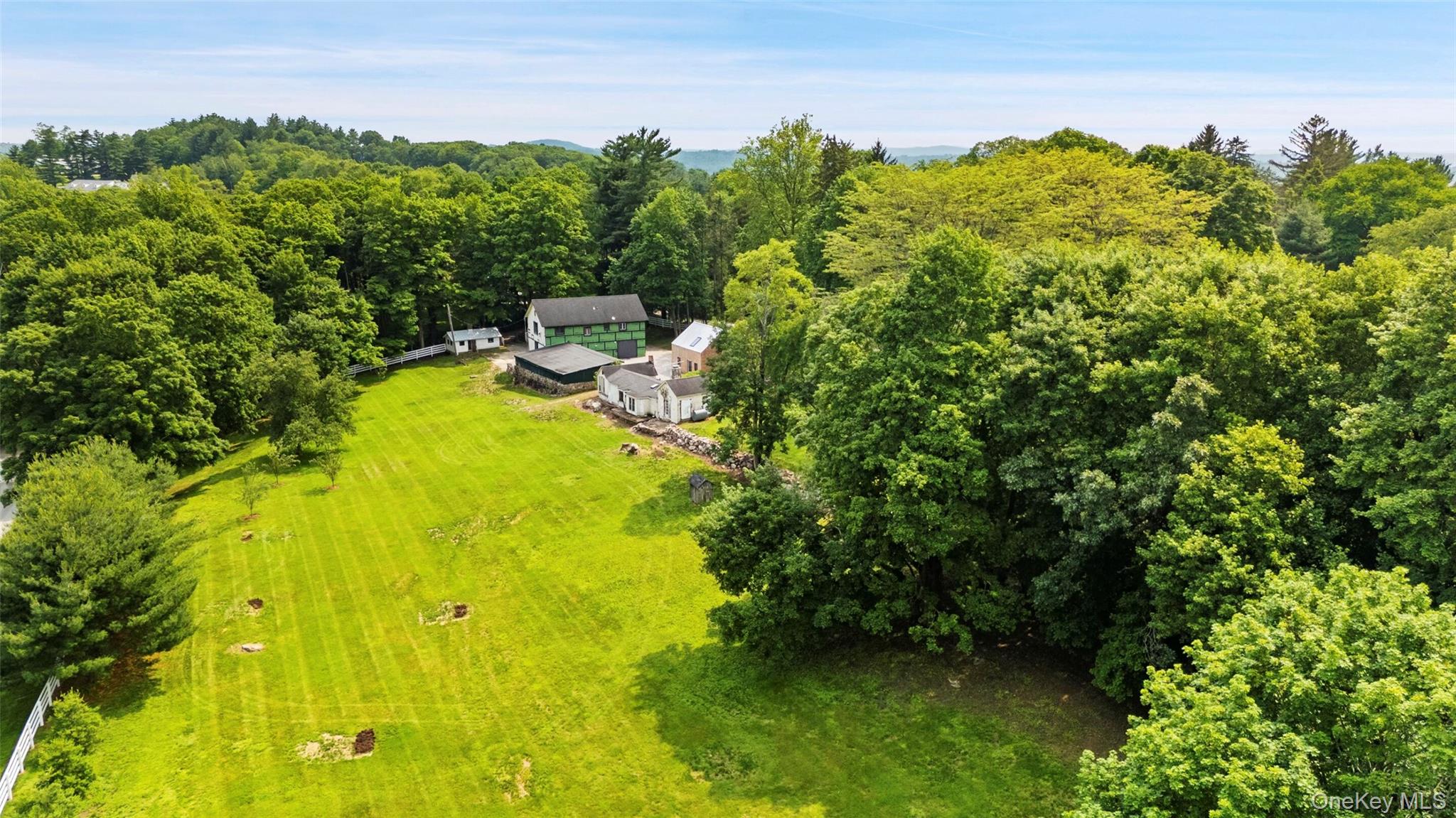 310 Mt Holly Road, Unit A Katonah, NY 10536 - Photo 6 of 33 a view of a swimming pool with an outdoor seating and a yard