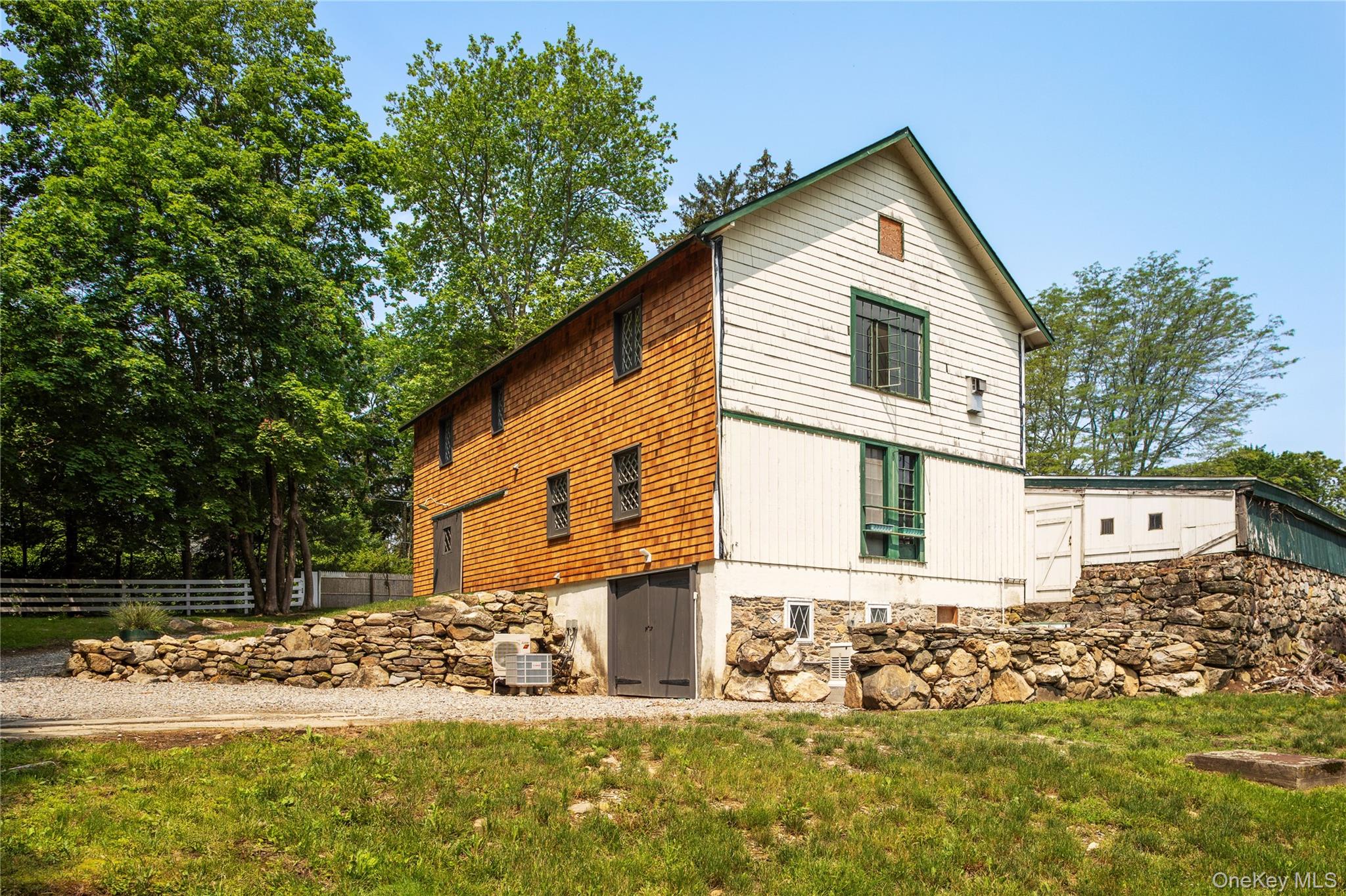 310 Mt Holly Road, Unit A Katonah, NY 10536 - Photo 10 of 33 a front view of a house with a yard