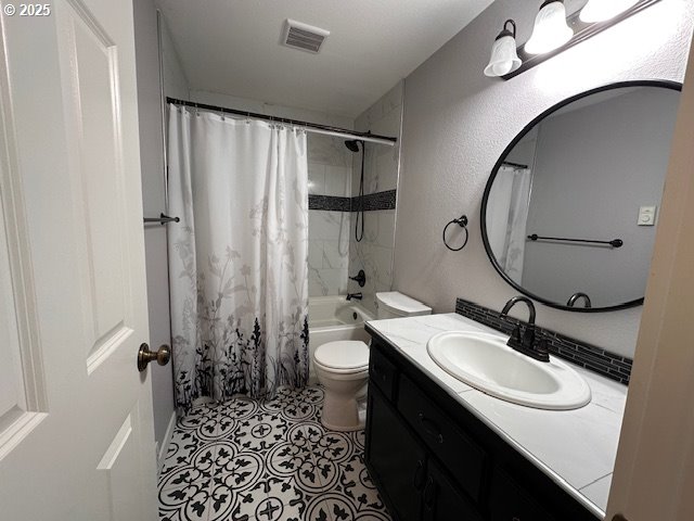 3932 Spruce Street Florence, OR 97439 - Photo 13 of 39 a bathroom with a sink a toilet and shower