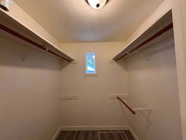 a view of a closet area with an empty room