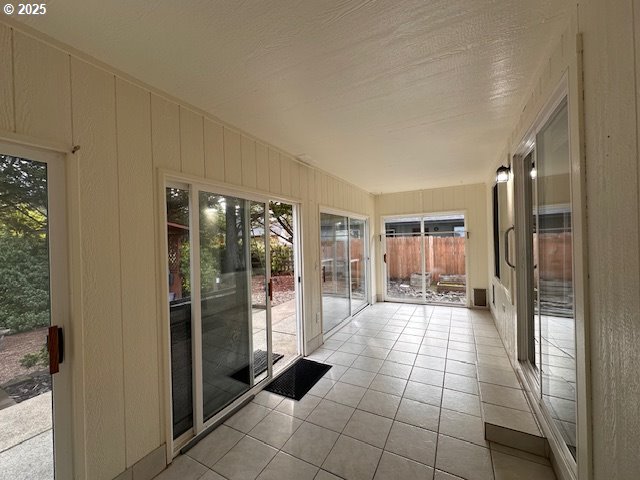 3932 Spruce Street Florence, OR 97439 - Photo 22 of 39 a hallway with a furniture and a large window