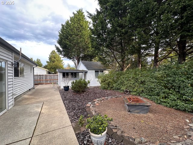 3932 Spruce Street Florence, OR 97439 - Photo 30 of 39 a front view of a house with garden