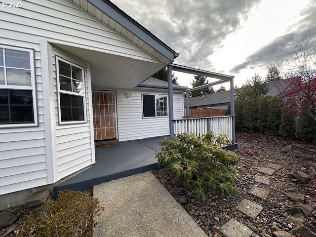 3932 Spruce Street Florence, OR 97439 - Photo 35 of 39 a view of a small house with a small yard and a large window