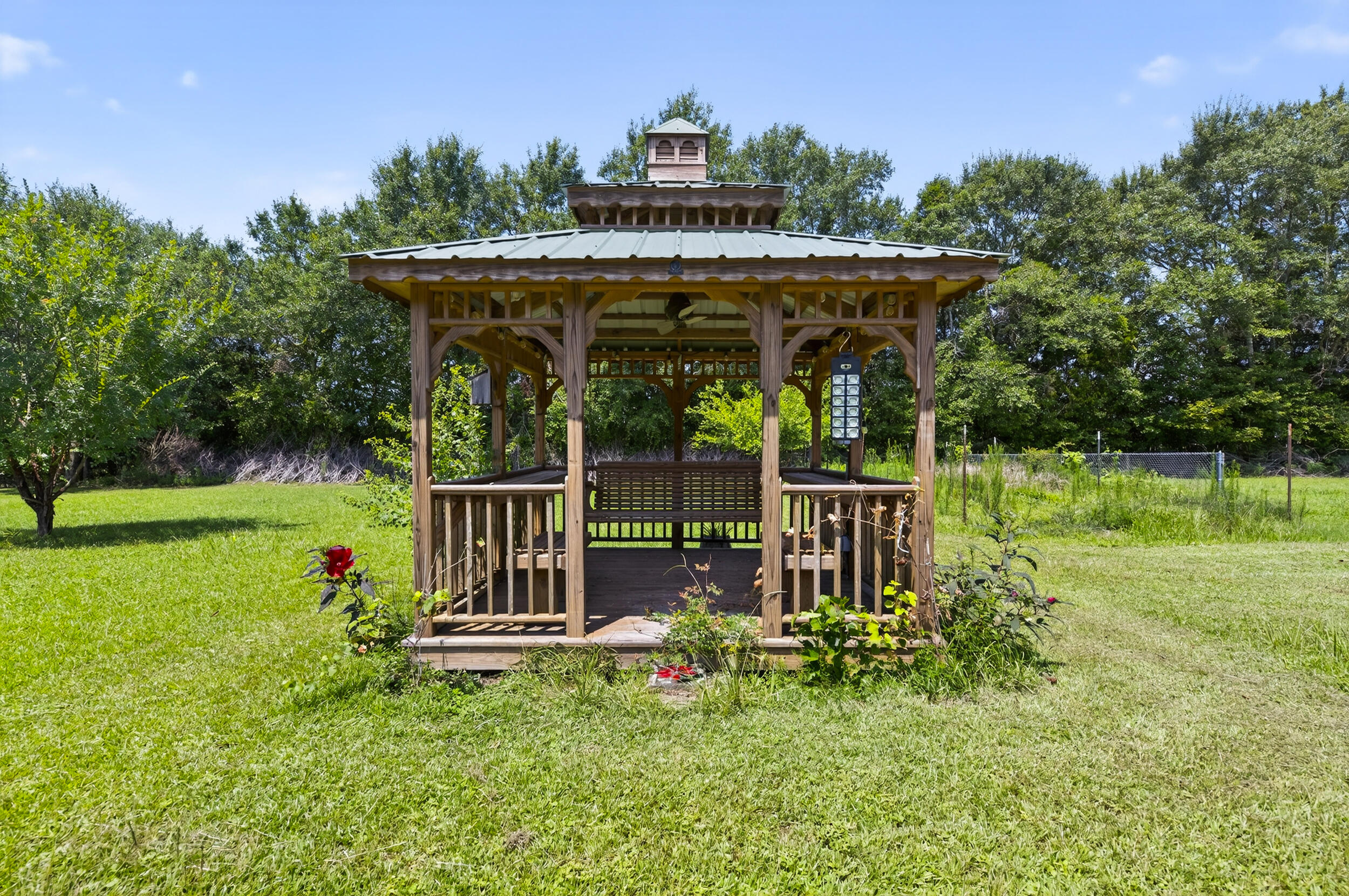 5589 Chalker Road Molino, FL 32577 - Photo 28 of 38 a view of a deck with a table and chairs