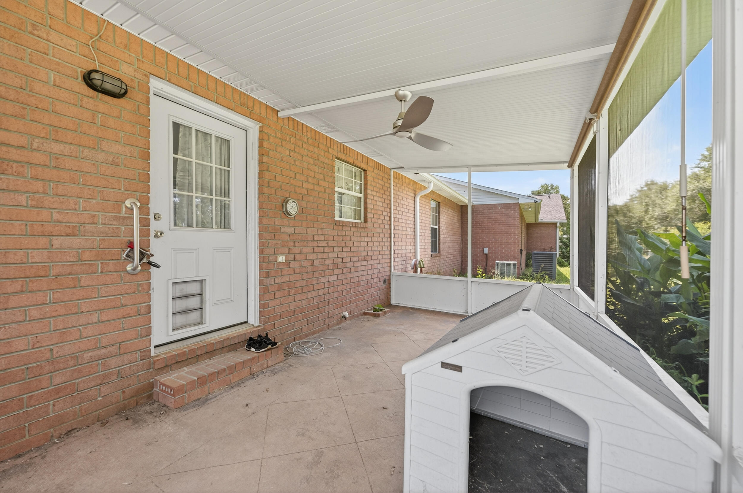 5589 Chalker Road Molino, FL 32577 - Photo 29 of 38 a view of a porch with a table and chairs