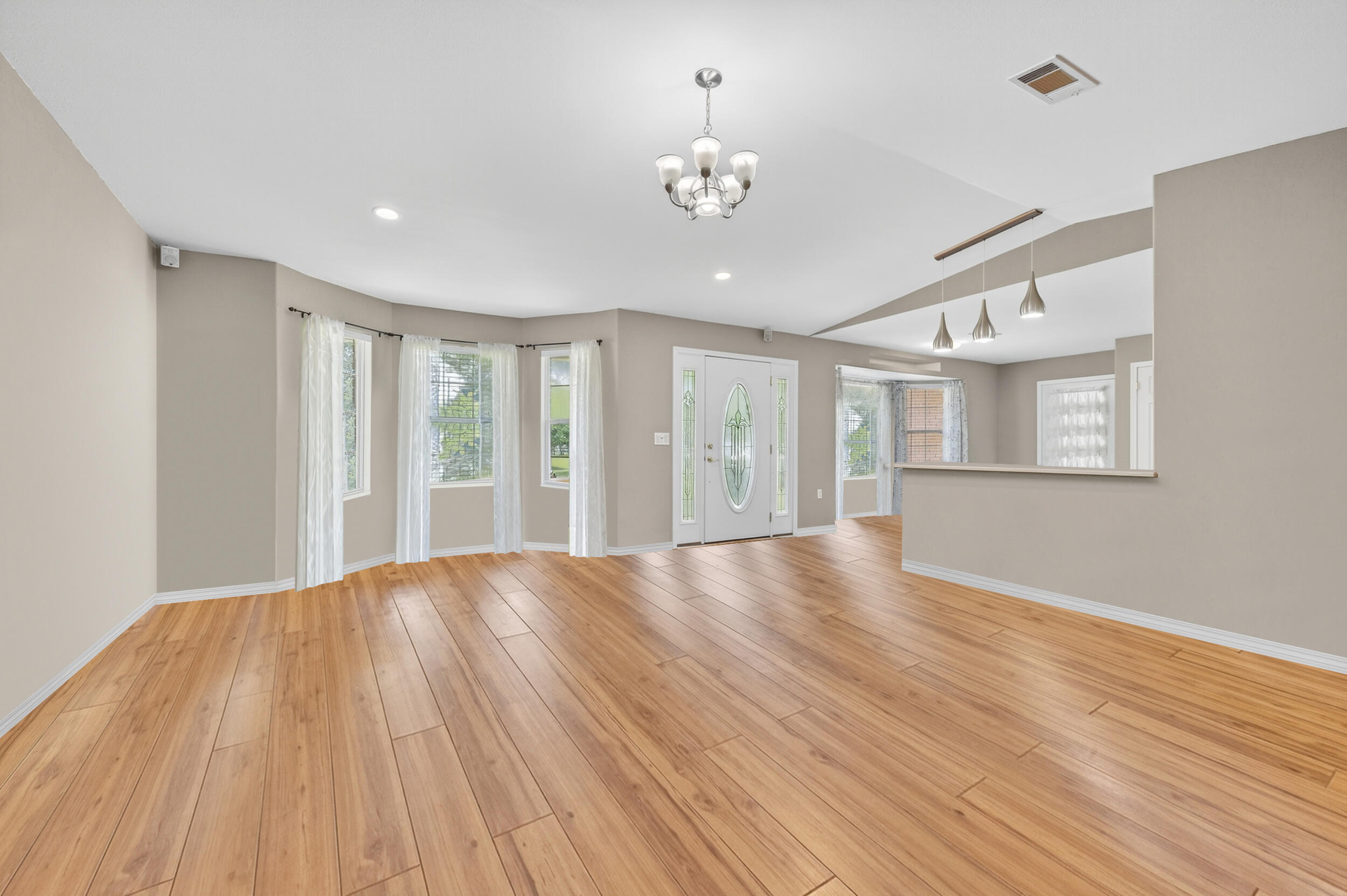 5589 Chalker Road Molino, FL 32577 - Photo 7 of 38 a view of an empty room with wooden floor and a window