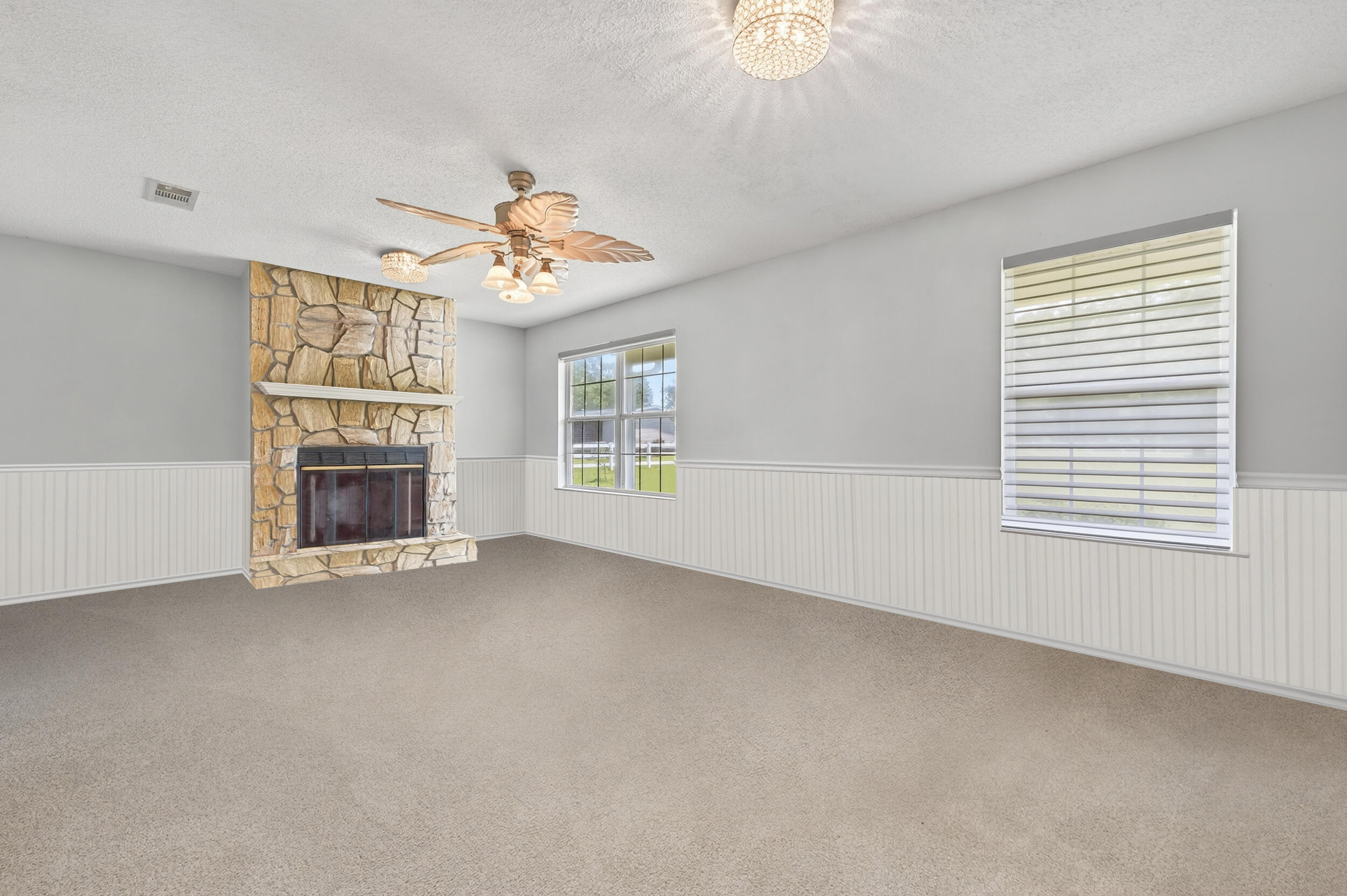 5589 Chalker Road Molino, FL 32577 - Photo 9 of 38 an empty room with chandelier fan and windows